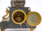 a clock that is sitting on top of a table