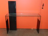 an image of a glass desk with a computer on it