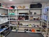 a room with a lot of shelves and bags on the shelves