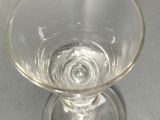 a clear glass that is sitting on a table