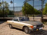 a car that is parked in front of a gate
