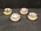 three tea cups and saucers are sitting on a black surface