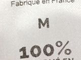 a label on a white shirt that says cocorico