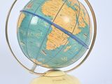 a small blue and yellow globe on a yellow stand