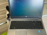 a laptop that is sitting on a desk in a room