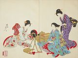 two asian women in kimono robes sitting on the floor