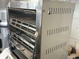 a toaster oven sitting on top of a stove in a kitchen