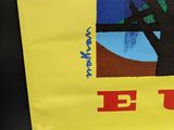 a yellow poster with a picture of a tree on it
