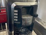 a coffee maker that is sitting on top of a counter