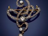 an antique diamond and gold broochle