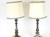 pair of antique brass table lamps with white shades on them