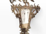 an image of a wall mounted light with a mirror on it