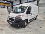 a picture of a white van parked in a warehouse