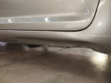 a close up of a car ' s rear end with a flat tire