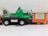 three toy trucks that are sitting next to each other