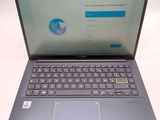 a laptop with a keyboard on it sitting on a table