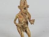 figurine in the form of a man with a hat on his head and hands on his hips