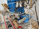 a picture of a machine that is working on a piece of wood
