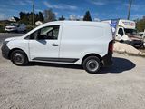 a white van that is parked on the side of the road