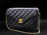 a chanel black quilted leather shoulder bag with gold hardware