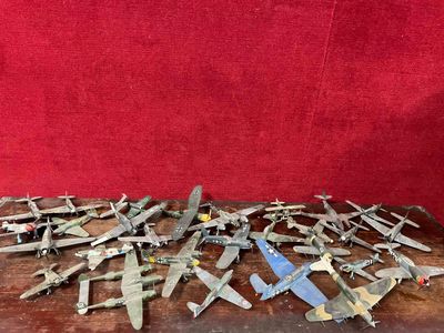 a lot of airplanes that are sitting on a table