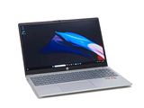 a laptop that is sitting on a white surface