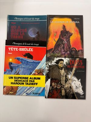 three books are stacked on top of each other on a table