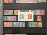 a collection of stamps on display in a display case