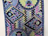 an image of a colorful scarf hanging on a wall