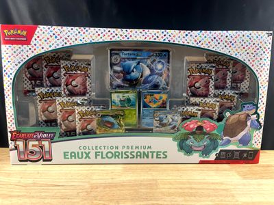 the box contains a collection of pokemon cards and other collectibles