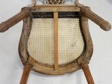 a wooden chair with a woven seat and back
