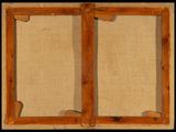 an old picture of a pair of wooden frames sitting on top of a table