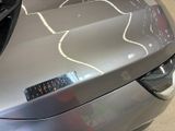 a close up of a car with a sticker on it ' s hood