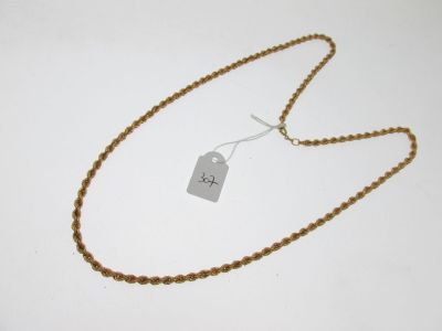 gros plan d'un collier auquel est attachée une étiquette