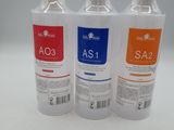 three bottles of water sitting next to each other on a white surface