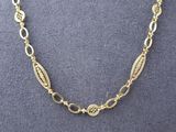 a gold plated necklace with oval links and oval links