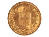 gros plan d'une pièce d'or sur fond blanc
