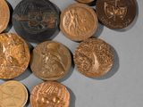 a lot of coins that are laying on a table