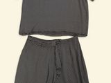 a black and white shirt and skirt set with polka print