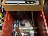 a box full of pens and pencils sitting on a table