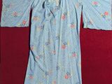 an image of a woman ' s blue robe with flowers on it
