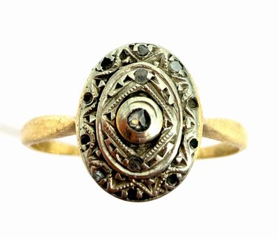 an image of a gold ring with a black diamond