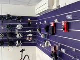 a purple wall with a bunch of bike helmets on it