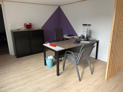 a room with a desk and a chair in it