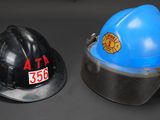 two hats that are sitting next to each other on a table