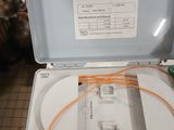 a white box with orange wires inside of it