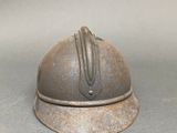 an old helmet that is sitting on a table