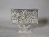 an image of a silver plate with an image of a man and a woman on it