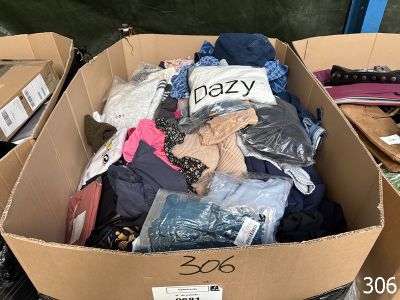 a cardboard box full of clothes and other items