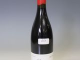 a bottle of wine that is sitting on a table